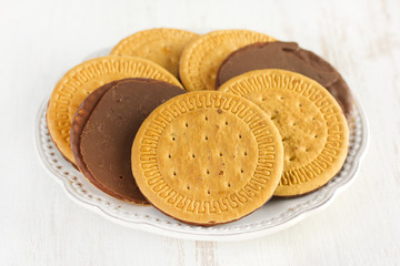 chocolate cookies on plate on white background