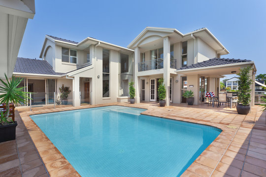 beautiful backyard with pooloutside of modern mansion