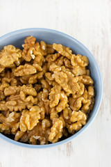walnut in bowl on white background