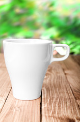 Coffee Cup and office supplies on old wood table