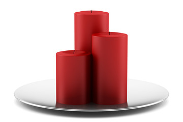 three red candles on chrome dish isolated on white background