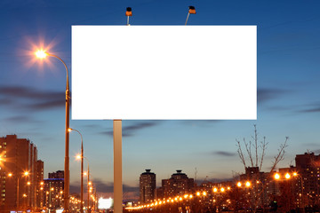 Empty roadside billboards at evening in city