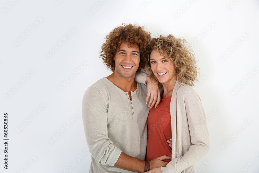 Wall mural Attractive couple standing on white background