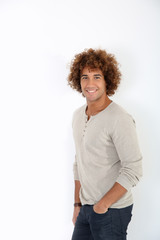 Cheerful handsome guy standing on white background