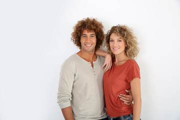 Fototapeta premium Attractive couple standing on white background