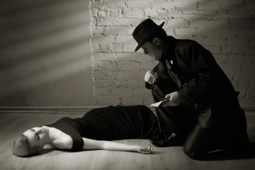 Detective investigating the crime scene