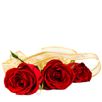 Valentine's background with three red roses isolated on white