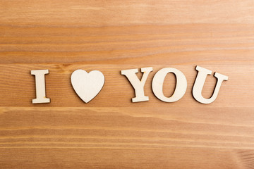 Wooden letters forming with phrase I Love You