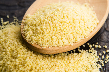 couscous in wooden spoon