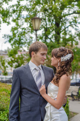 Young Bride and Groom Embrace