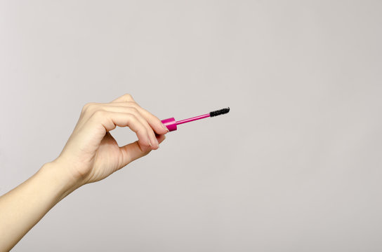 Close Up On A Woman Hand Holding A Make Up Brush