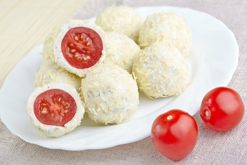 Cheese balls with a tomato cherry