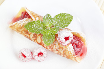 Dessert. Pancake with raspberry jam