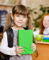 portrait of pretty preschool girl with backpack