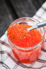 Spoon of red caviar