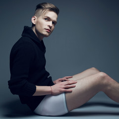 Men fashion concept. Young man in white underwear