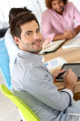 Fototapeta premium Smiling businessman attending business meeting
