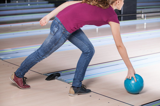 Woman Bowling. A woman having fun while bowling.