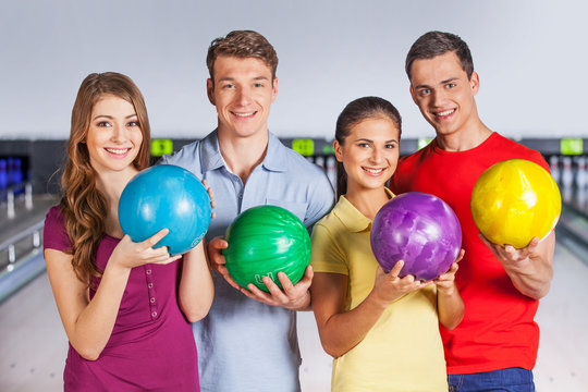 Group of people bowling.