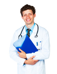 Portrait of smiling young male doctor writing on a patient's med