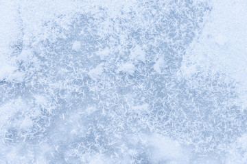 background ice on the frozen pond with snowflakes abstract form