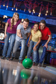 Group of friends bowling.