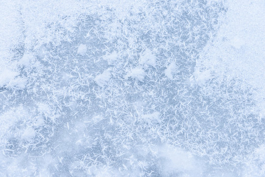 background ice on the frozen pond with snowflakes abstract form