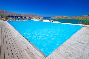 Blue swimming pool at Mirabello Bay in Greece