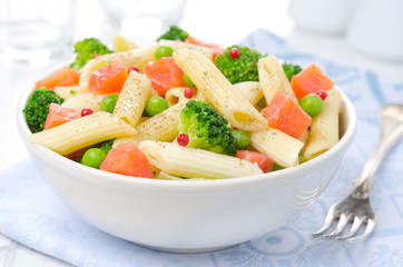 salad with pasta, smoked salmon, broccoli and green peas