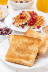 toast, waffles, peanut butter, jam, muesli for breakfast