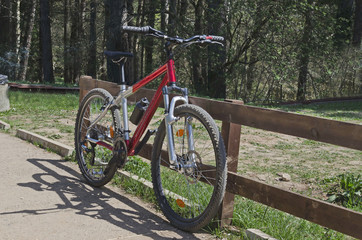 A red bicycle on the montane alley