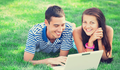 Students with laptop at outdoor