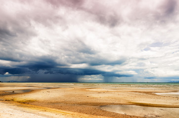 Stormy sky and beach at low tide