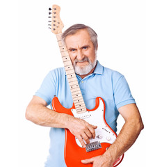Portrait of an senior man holding up guitar
