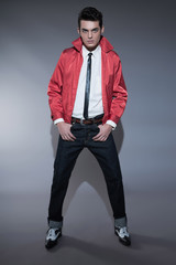 Retro rock and roll fifties fashion man with dark grease hair. W