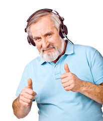 Senior man listening to music with headphones