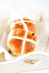 hot cross buns in wooden tray, shallow dof