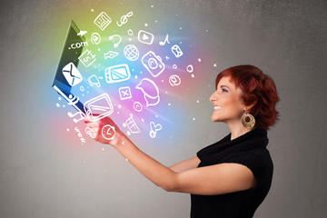 Young lady holding notebook with colorful hand drawn multimedia