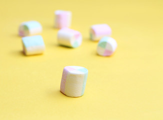 Marshmallows on yellow background