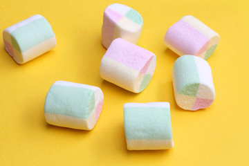 Marshmallows on yellow background