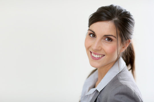 Smiling business girl standing on white background