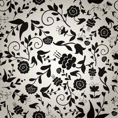 Seamless vintage pattern with black flowers on gray background