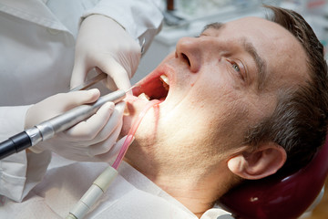 Male patient with dentist in a dental treatment