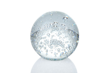 Crystal ball with bubbles and reflection isolated on white
