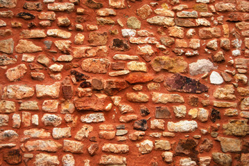 Texture Mur ocre en pierres sèches