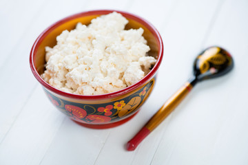 Cottage cheese in russian khokhloma tableware