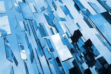 Abstract blue mirrors background above the sky