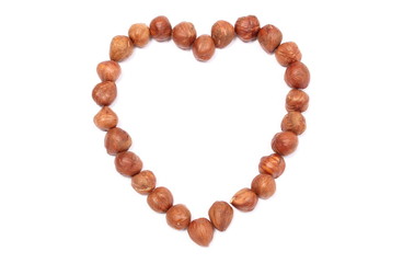 Valentine heart of hazelnut on white background