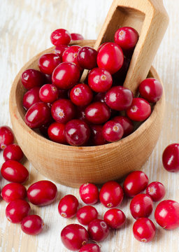 Cranberries on wooden table