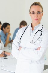 Portrait of doctor standing arms crossed